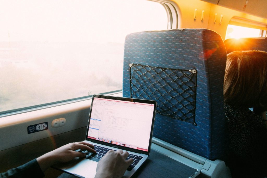 Digital nomad working on a train